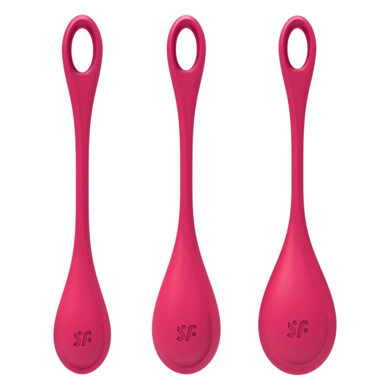 Gros plan sur les boules de geisha Yoni Power 1 rouges, avec le logo Satisfyer visible sur chaque pièce.